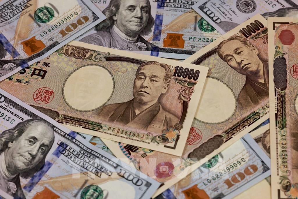 Đồng yen giảm giá xuống mức thấp nhất trong 34 năm - Ảnh 1.